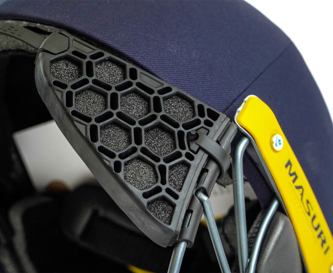 Detail view of Masuri StemGuard Elite Senior mounted on helmet with yellow branding