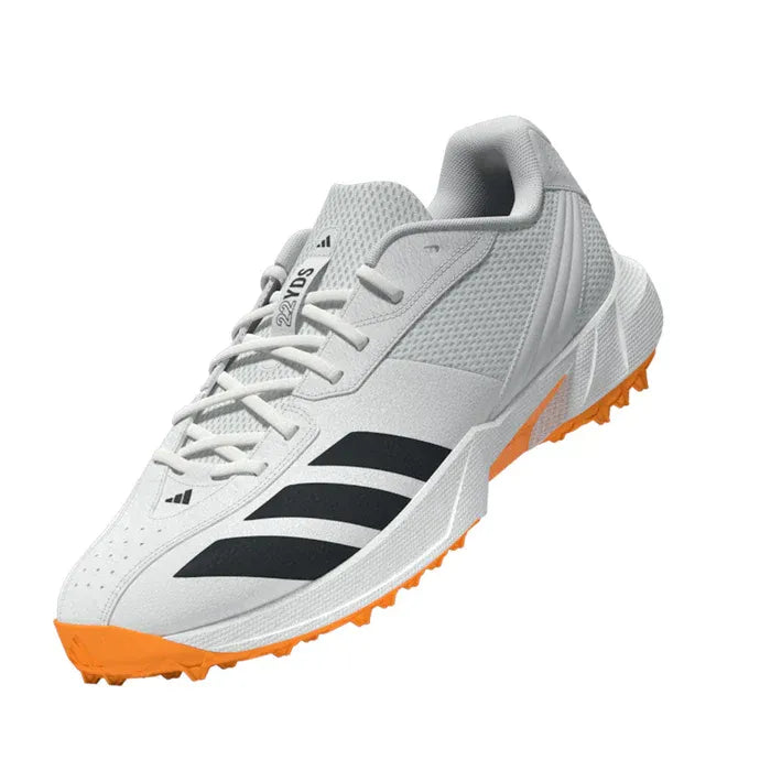 front angled view of Adidas 22YDS Spikeless Cricket Shoe in white with orange sole