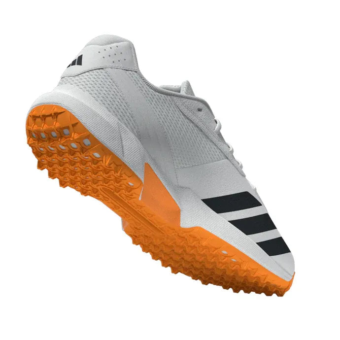bottom view of orange anti-slip sole of Adidas 22YDS Spikeless Cricket Shoe