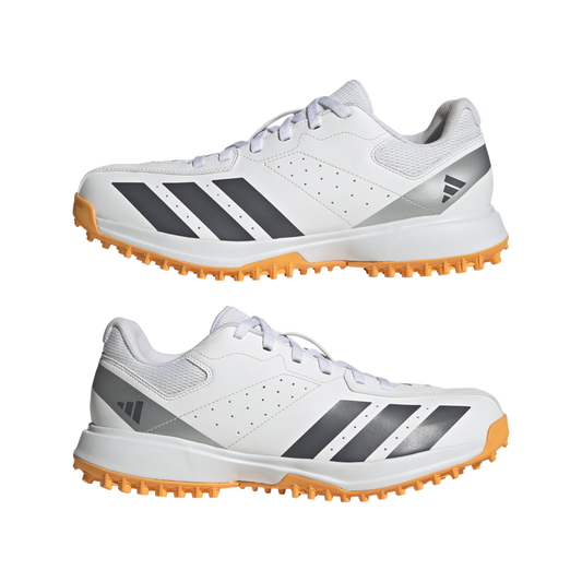 Side view of the Adidas Howzat spikeless indoor cricket shoe with rubber outsole.