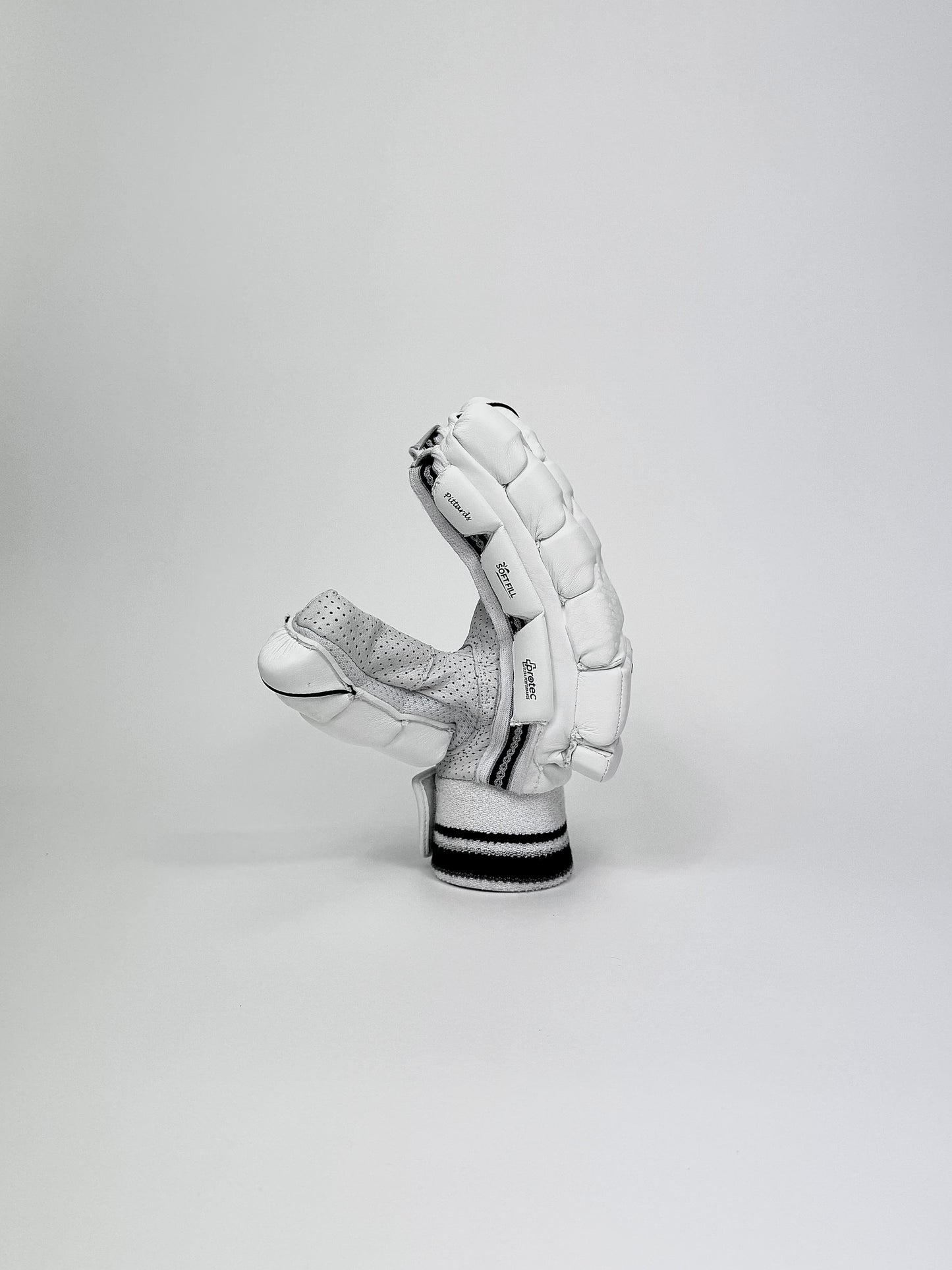 Side view of Bat Bros Players Edition batting glove highlighting three-piece side protection and ergonomic build