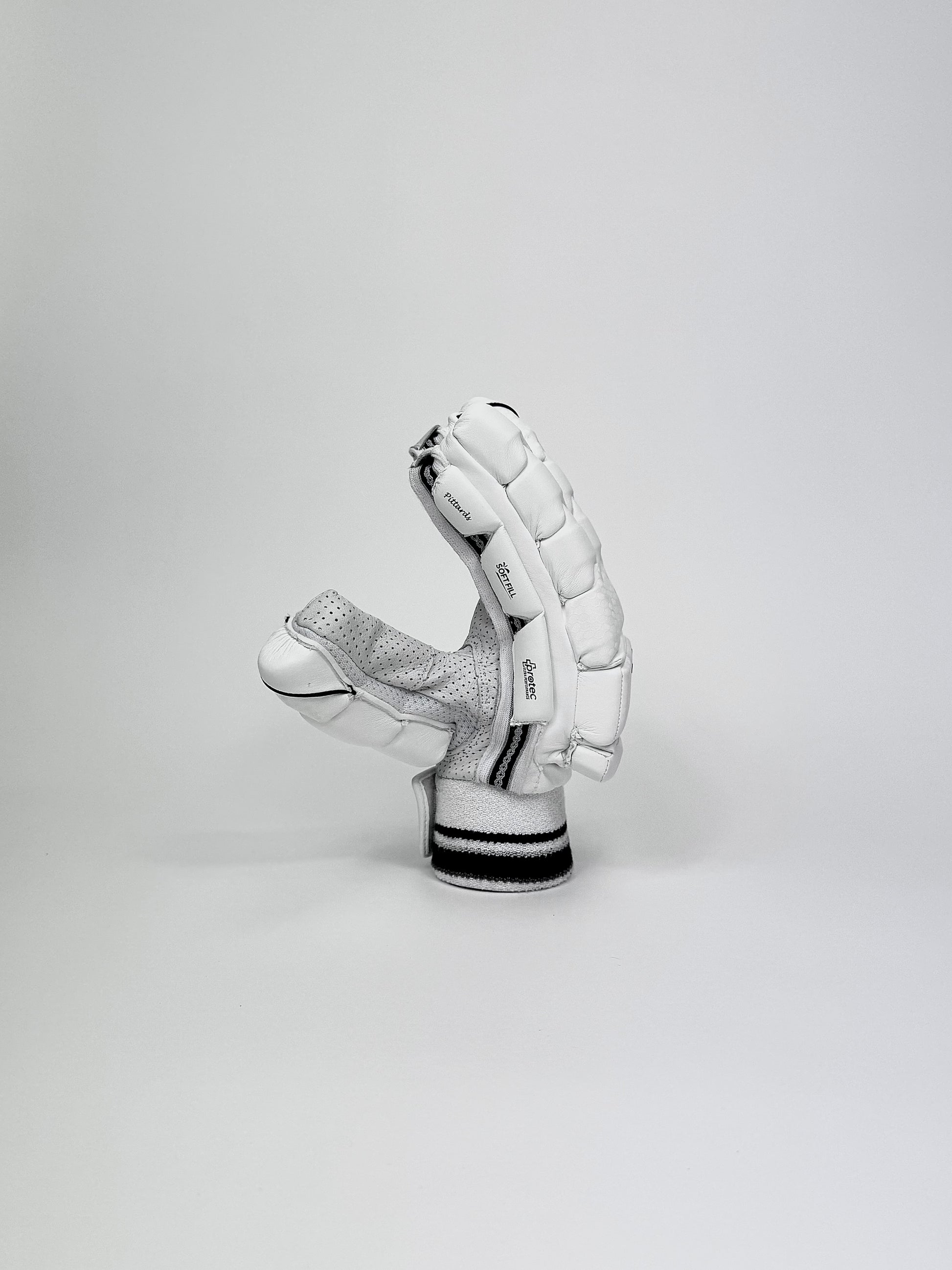 Side view of Bat Bros Players Edition batting glove highlighting three-piece side protection and ergonomic build