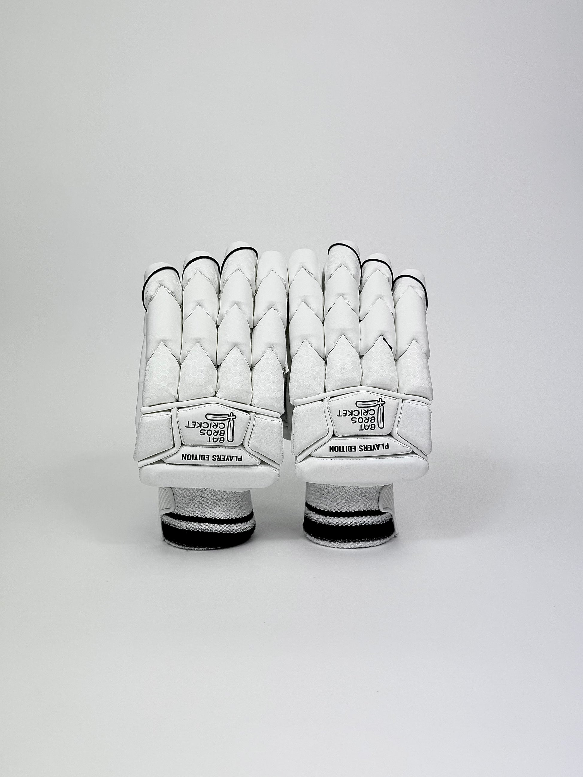 Back view of Bat Bros Players Edition batting gloves showing shark tooth padding and bold logo branding