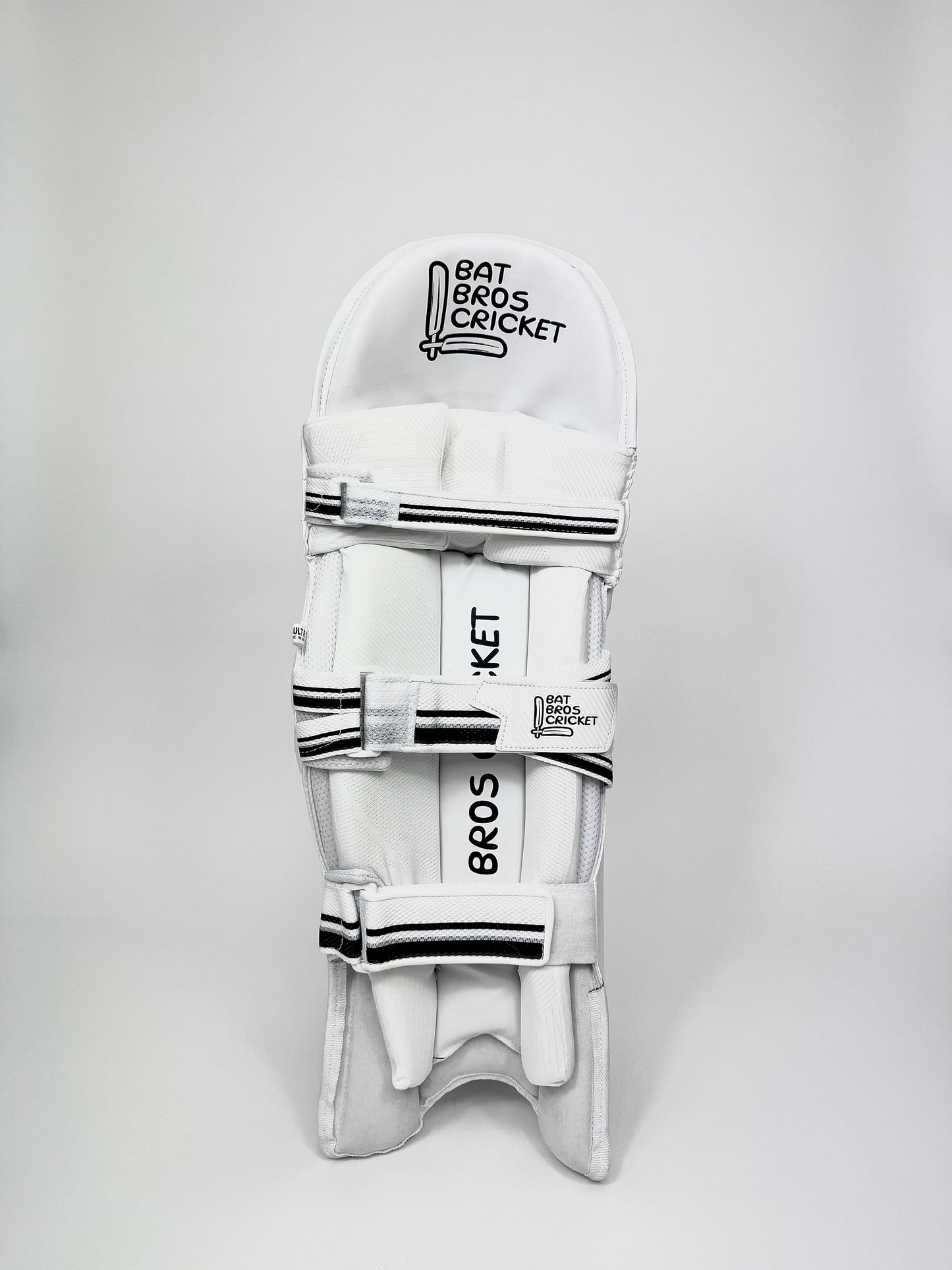 Inside view of batting pads showing butterfly straps and mesh lining
