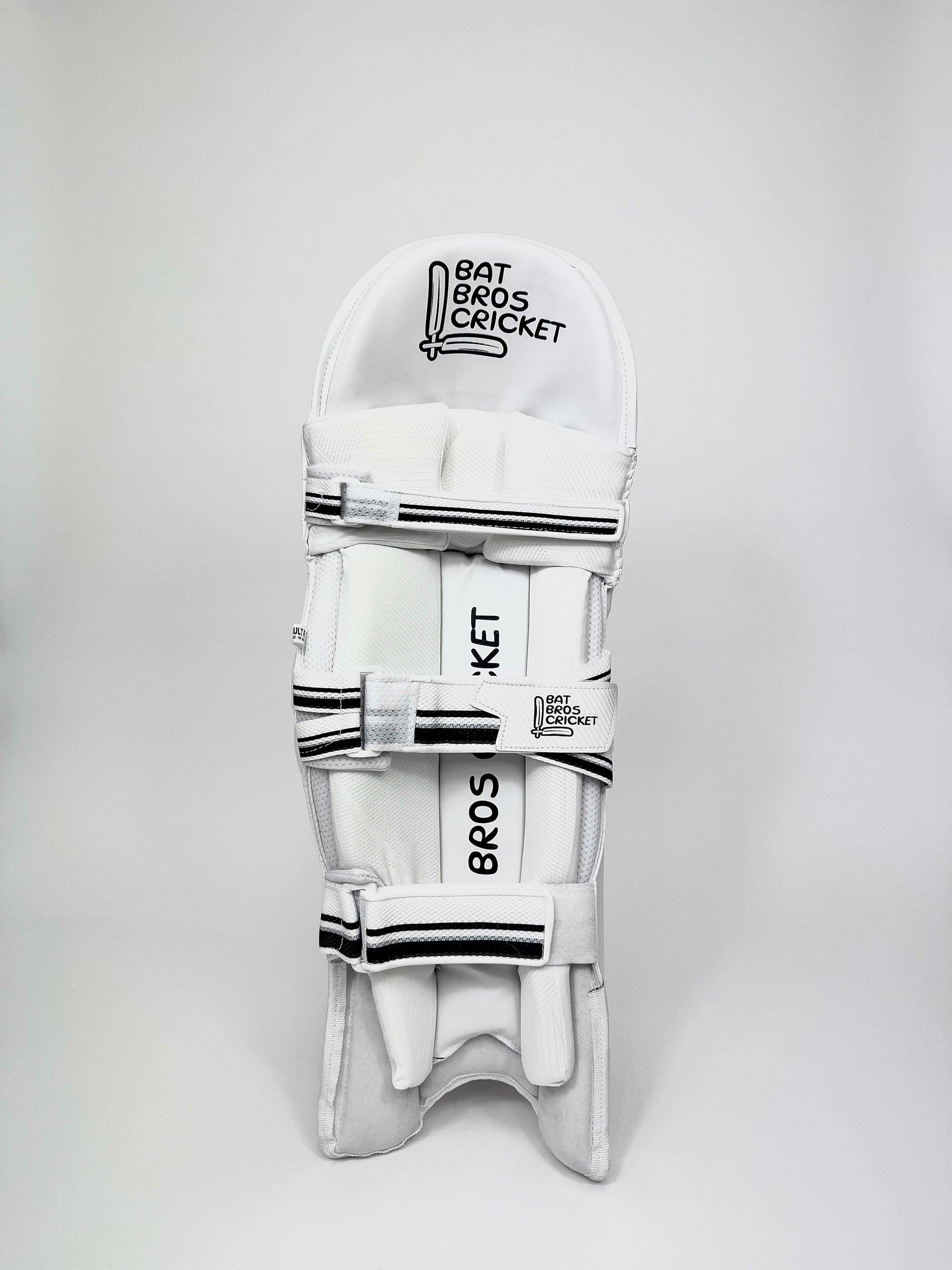 Inside view of batting pads showing butterfly straps and mesh lining
