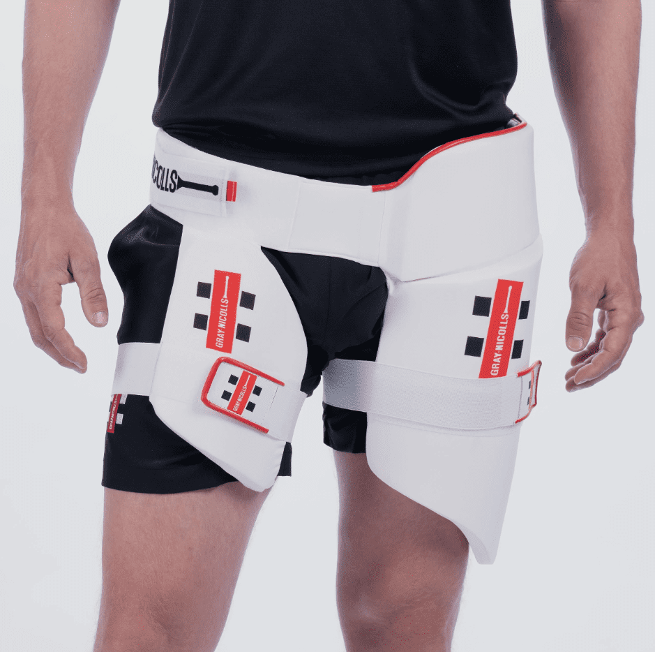 Gray-Nicolls All-in-One 360 Thigh Pad – White, showing full lower-body protection worn by player