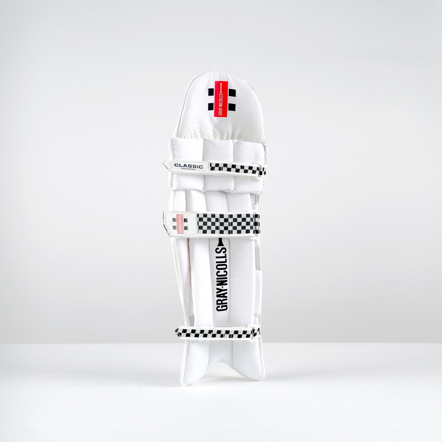 Angled view of Gray-Nicolls Classic Academy batting pads with straps