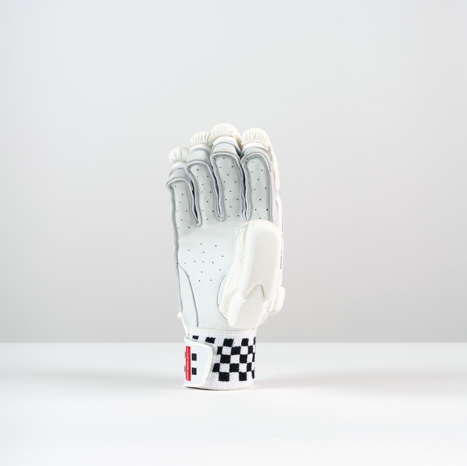 front view of a single Gray-Nicolls Classic Players Batting Glove in white with red logo