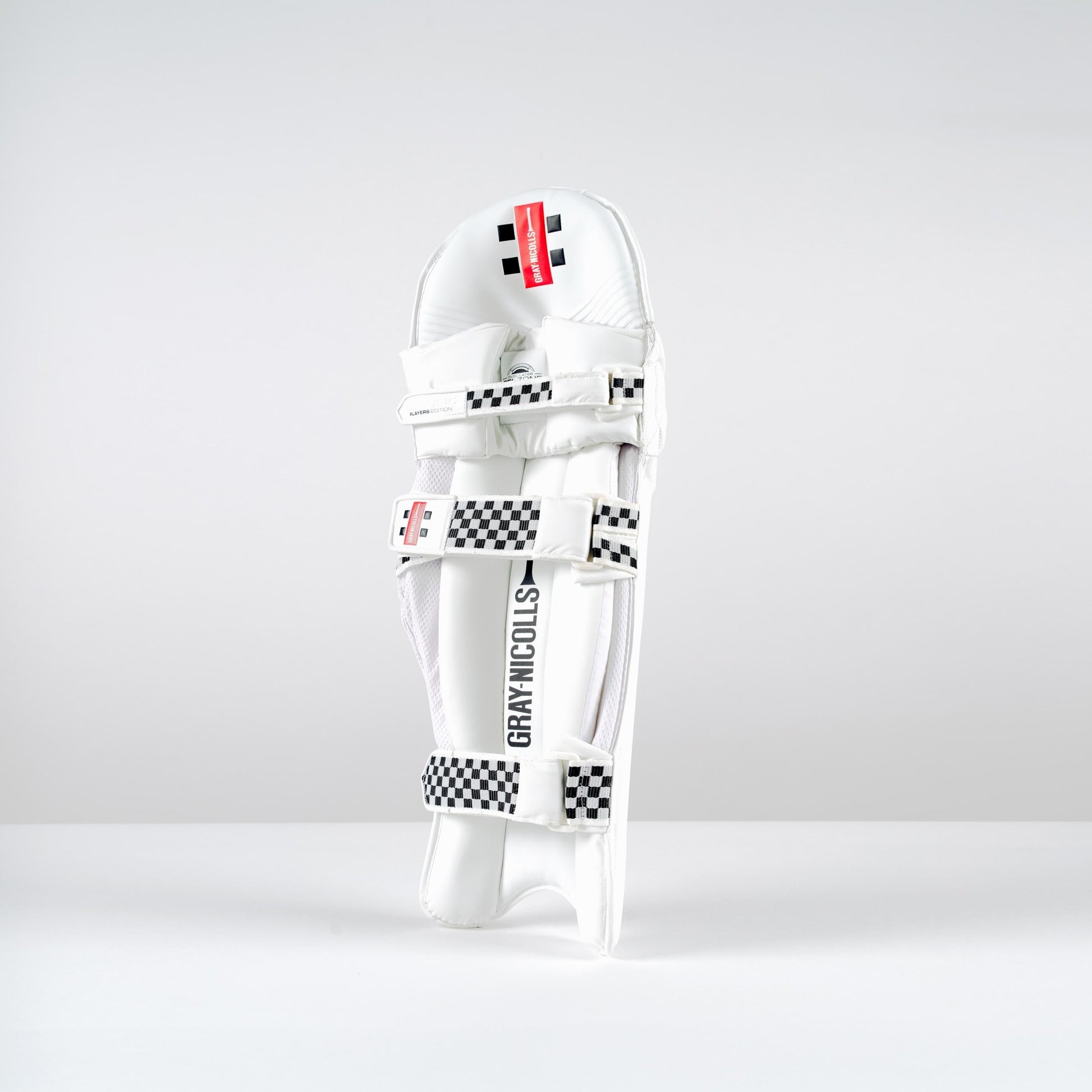 Side view of Gray-Nicolls Classic Players Edition white cricket batting pads