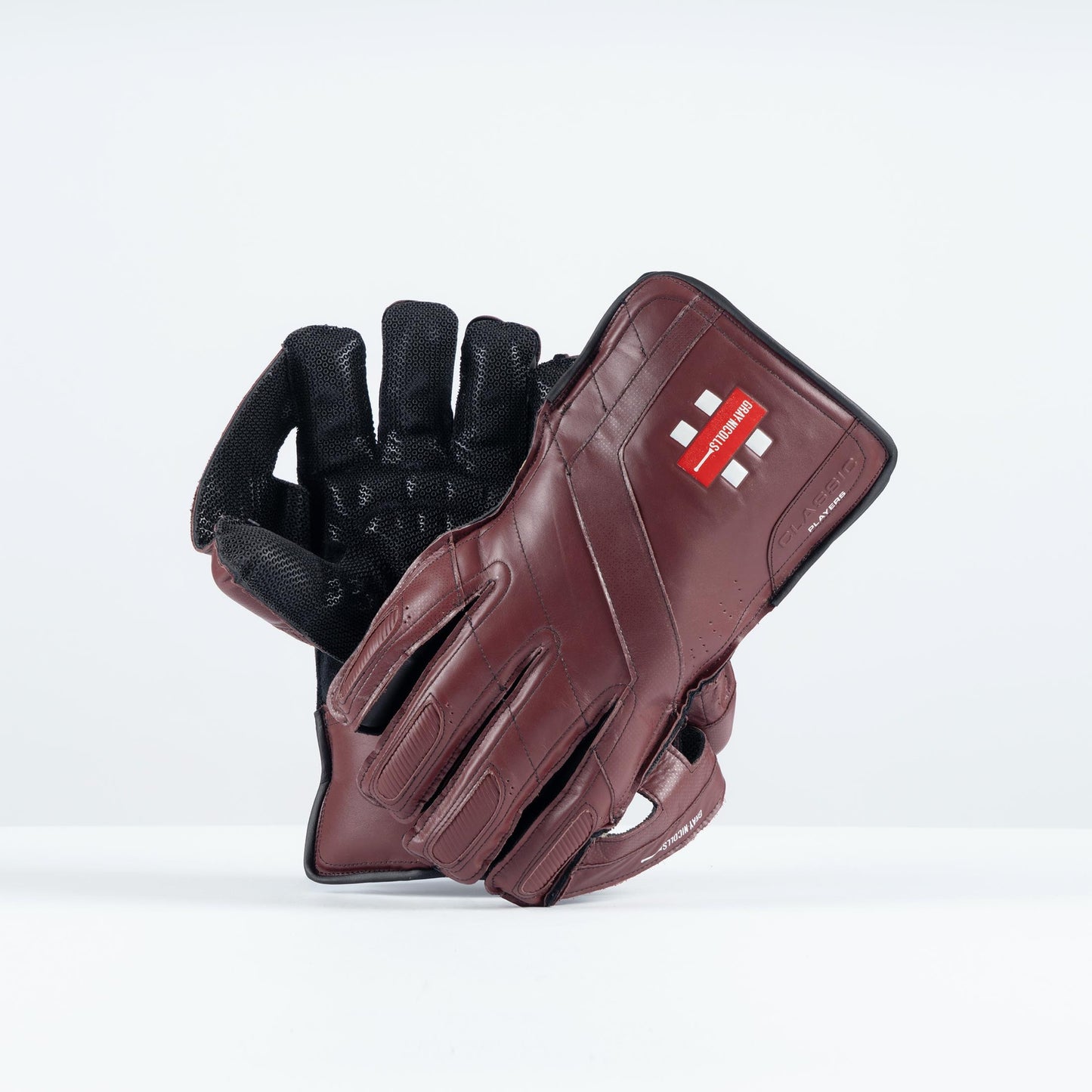 pair of Gray-Nicolls Classic Players gloves in dark brown and black leather