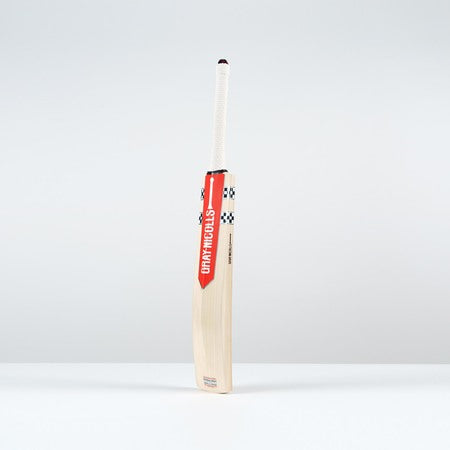 Rear angled view from the left showing the bat’s back stickers and contoured scoop.