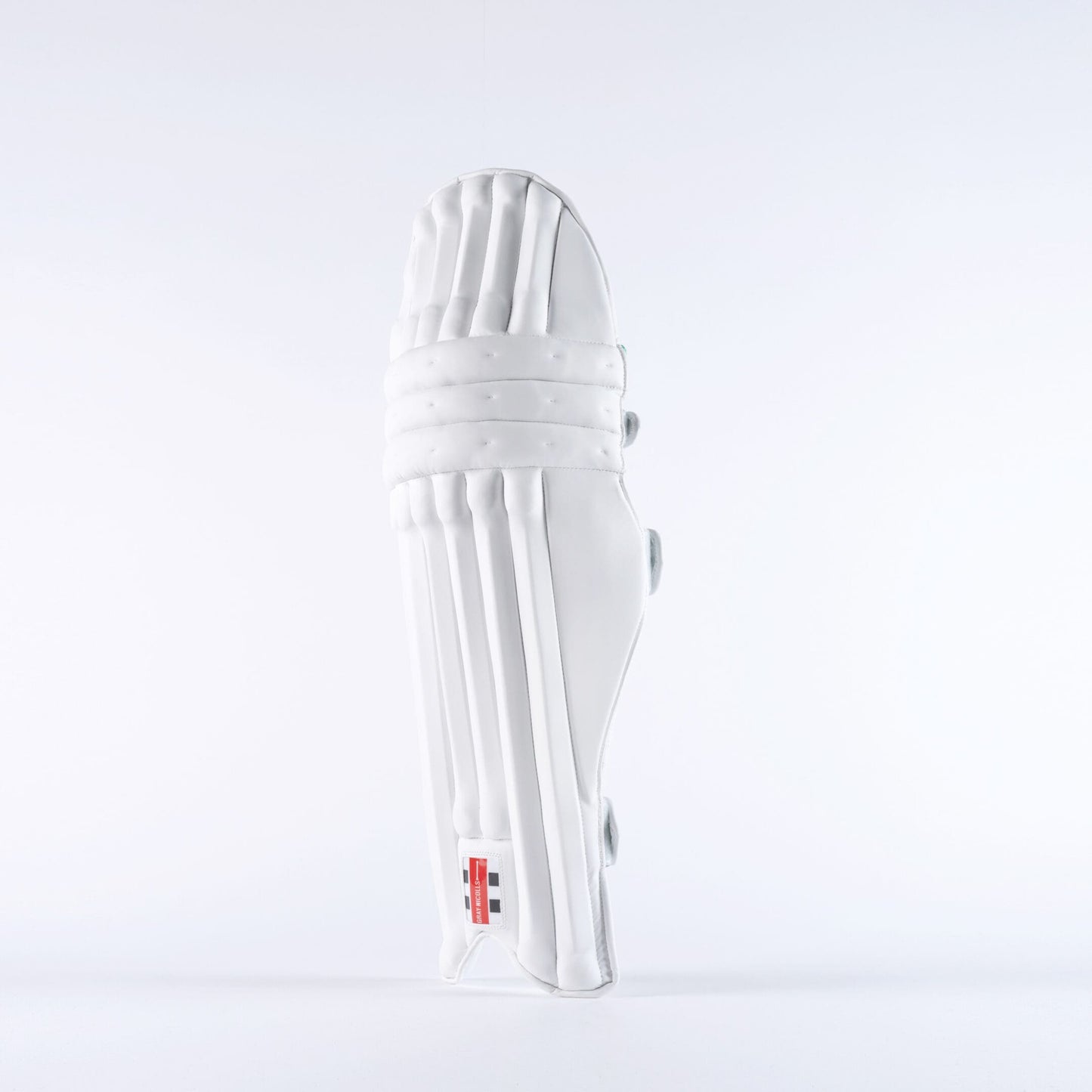 Side profile of Gray-Nicolls Classic Pro Performance pads in white showing curved shape and ankle wing