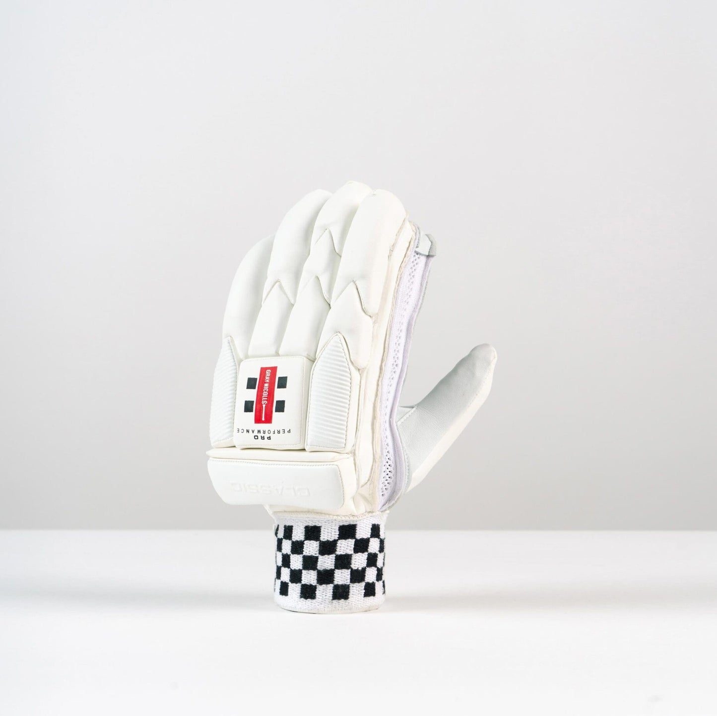 Angled side view of Gray-Nicolls Classic Pro Performance Glove showing ergonomic shaping and wrist design