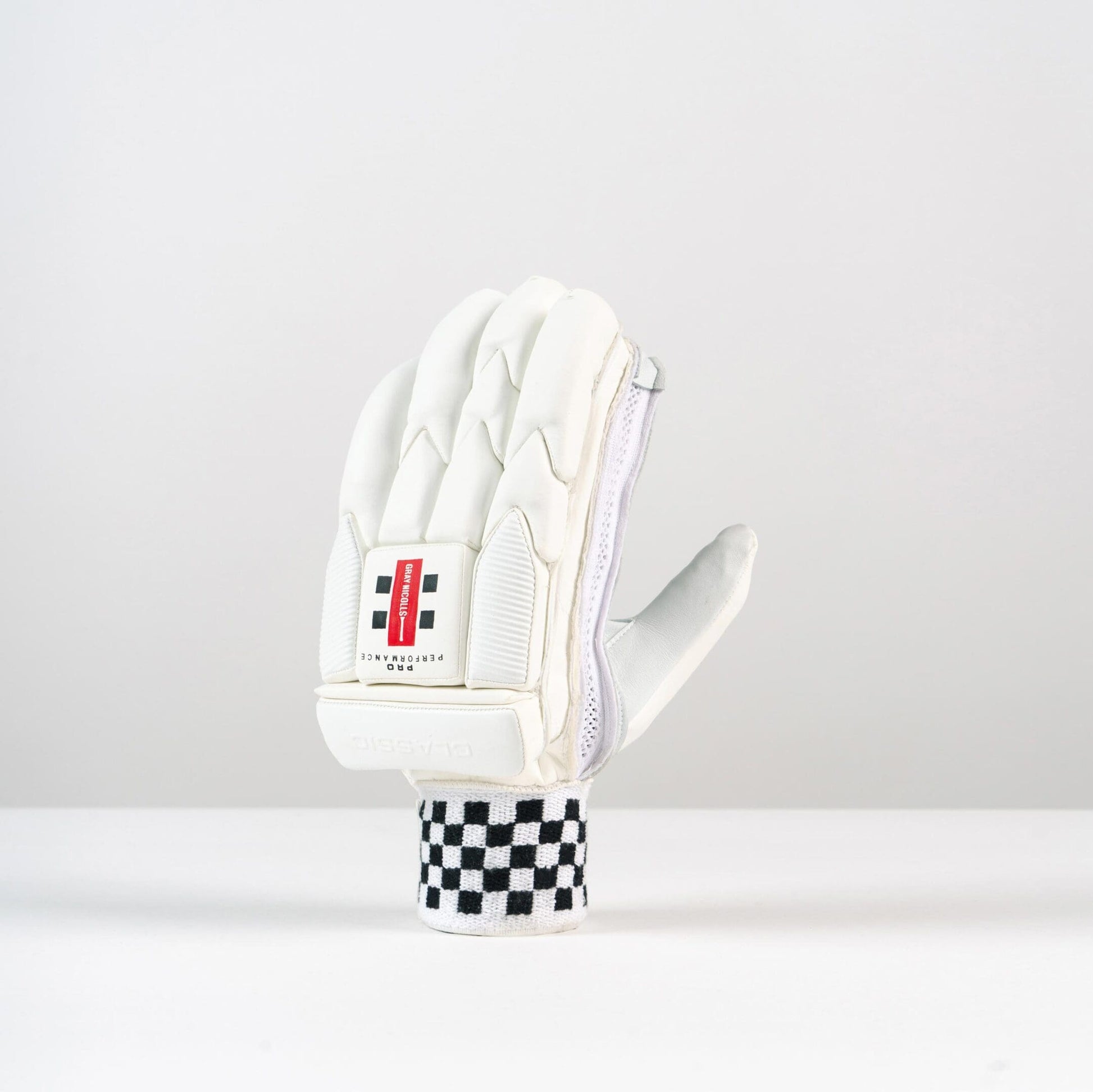 Angled side view of Gray-Nicolls Classic Pro Performance Glove showing ergonomic shaping and wrist design