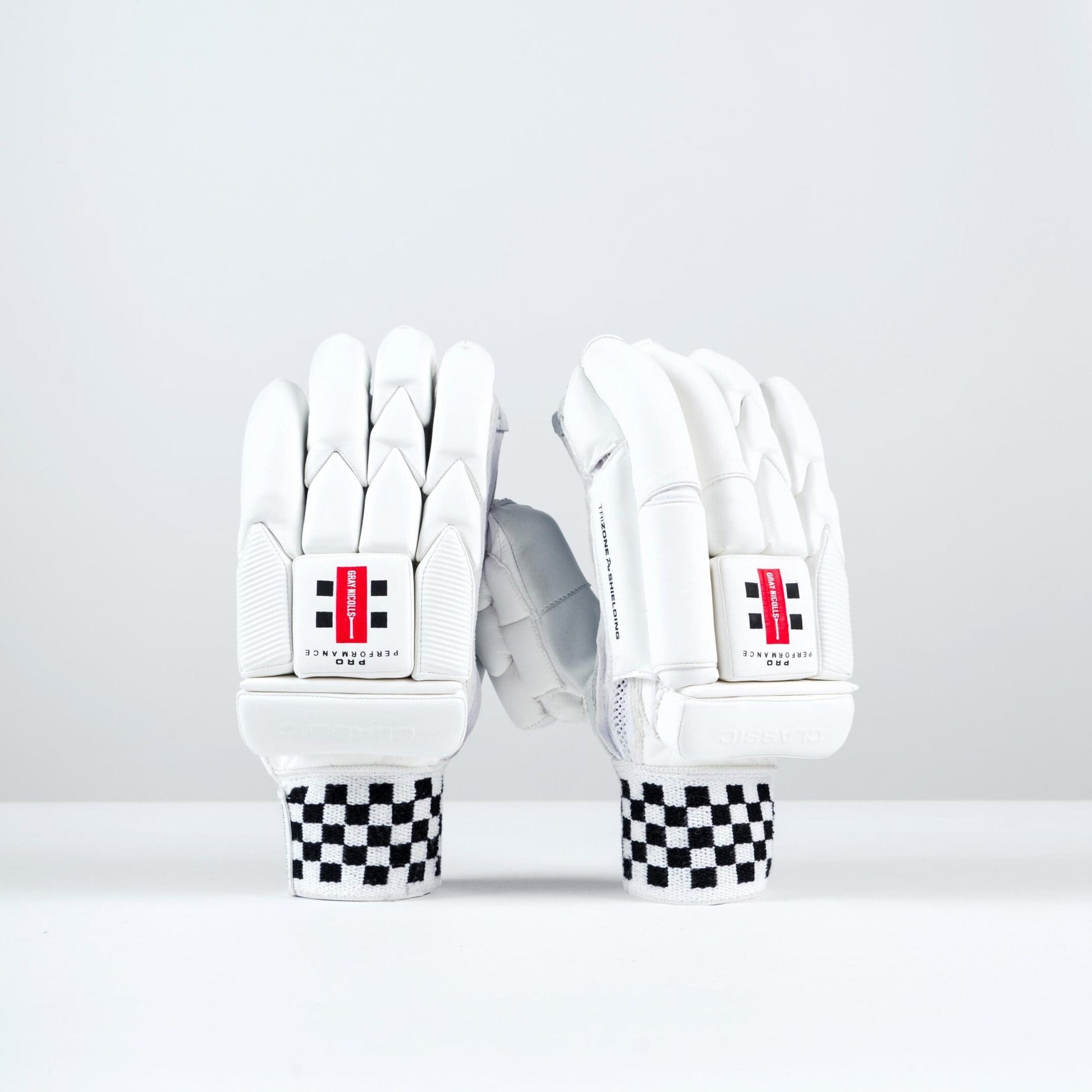 Gray-Nicolls Classic Pro Performance Batting Gloves in white, showing full front and back design with red logo and checkered cuff
