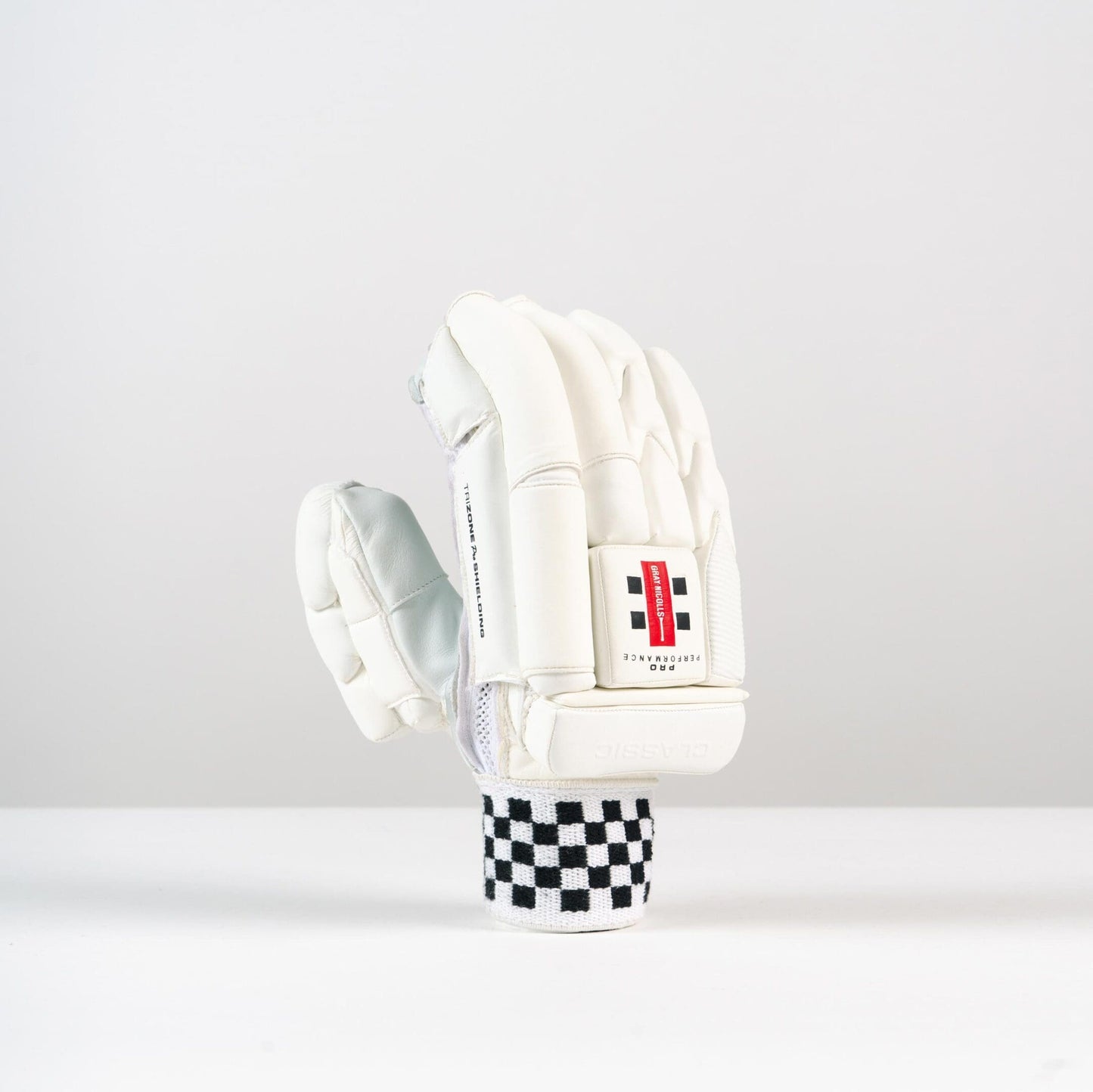 Gray-Nicolls Classic Pro Performance Batting Gloves in white shown side-by-side, profile view highlighting thumb and finger contours