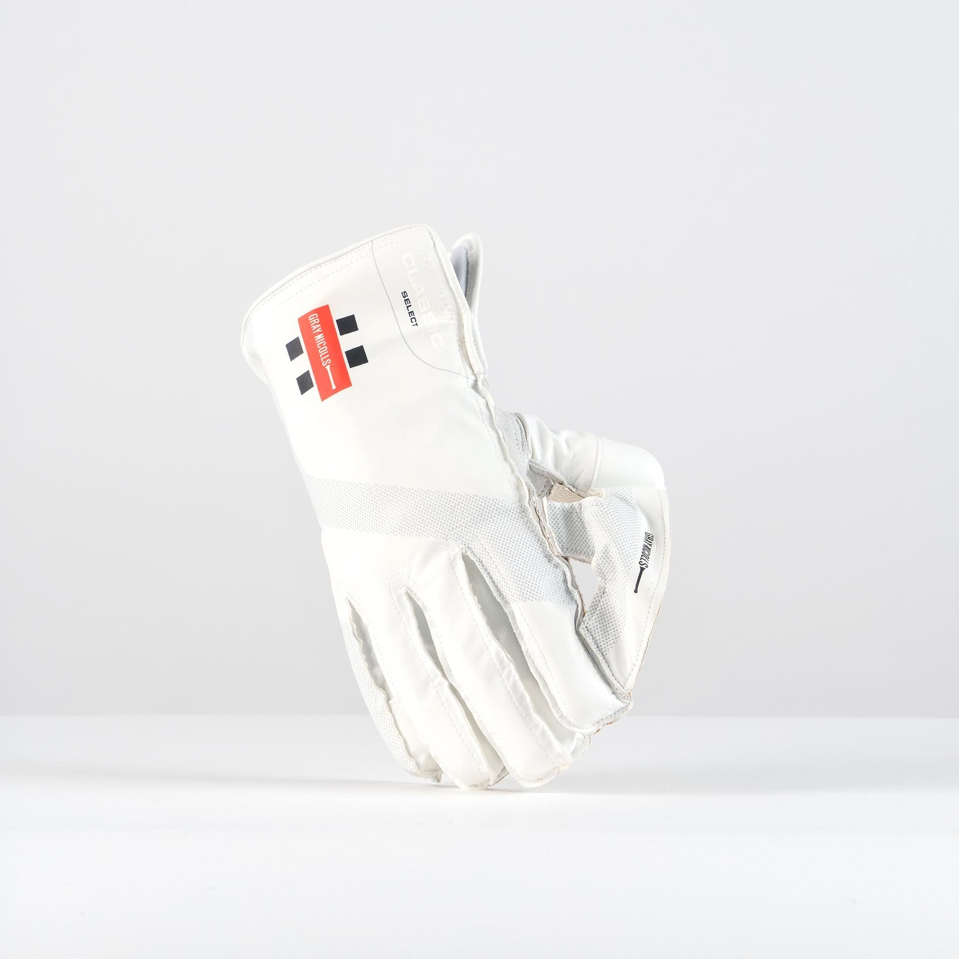 Side view of Gray-Nicolls Classic Select wicketkeeping gloves placed together showing cuff and structure