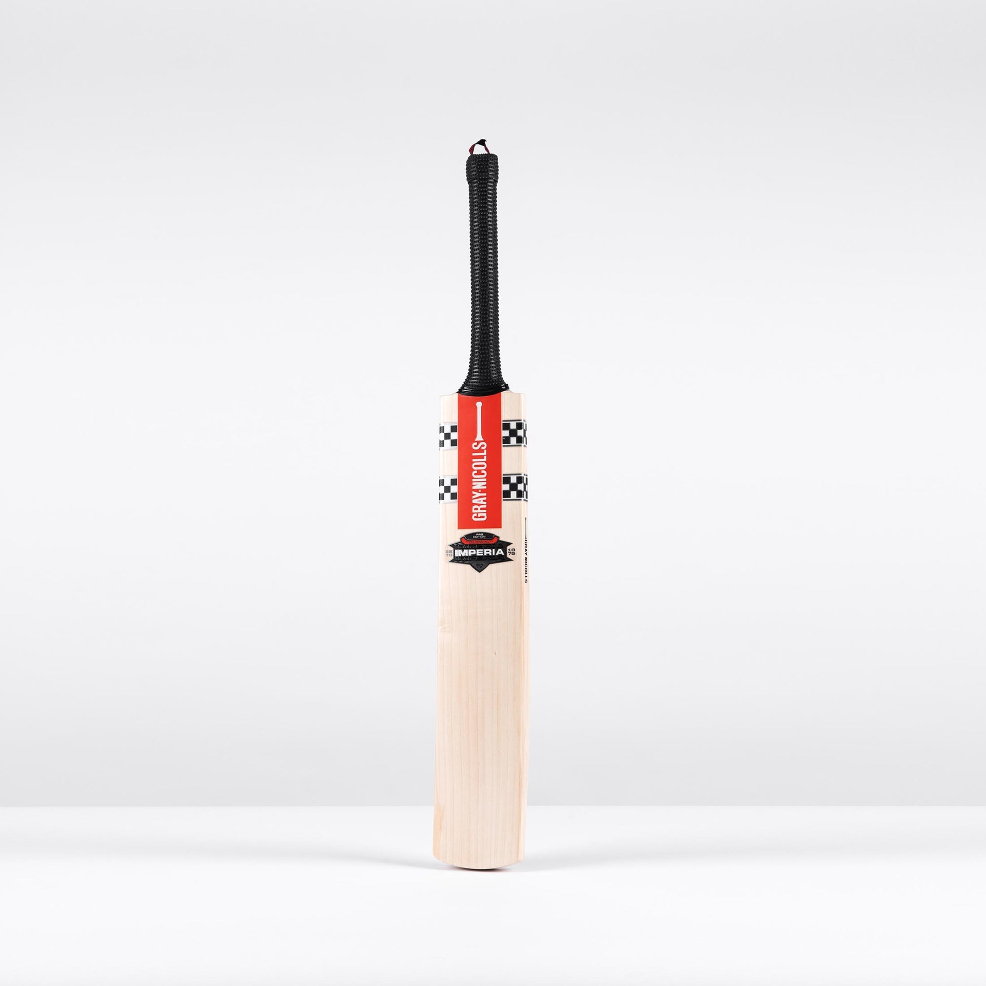 front view of Gray Nicolls Imperia Gen 1.0 Pro cricket bat with red stickers and black grip