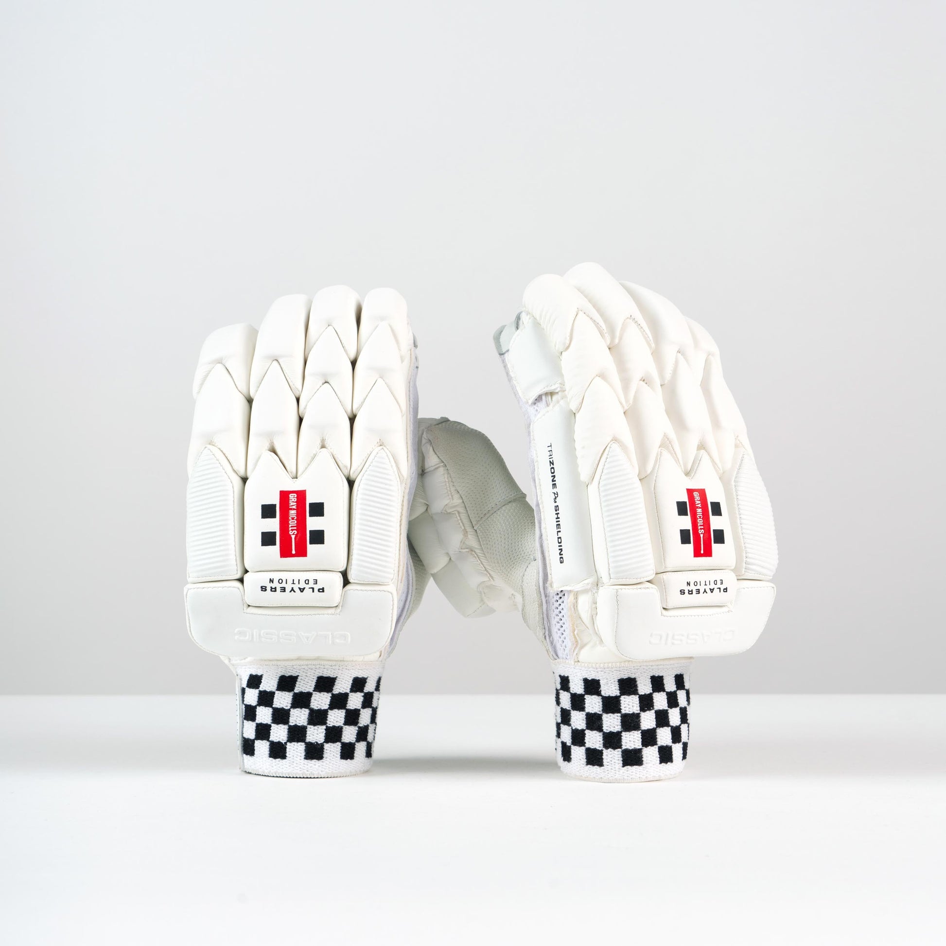 front view of Gray-Nicolls Classic Player Edition Batting Gloves with red logo and checkered wristband