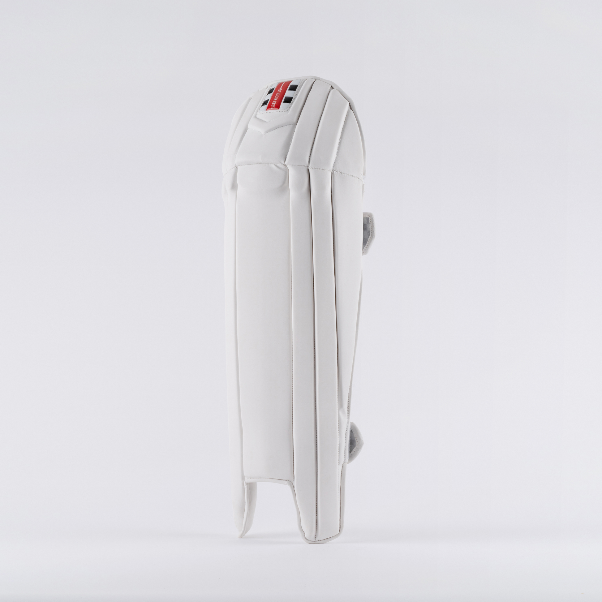 front view of Gray-Nicolls Prestige Wicket Keeping Pads in white with red and black logo