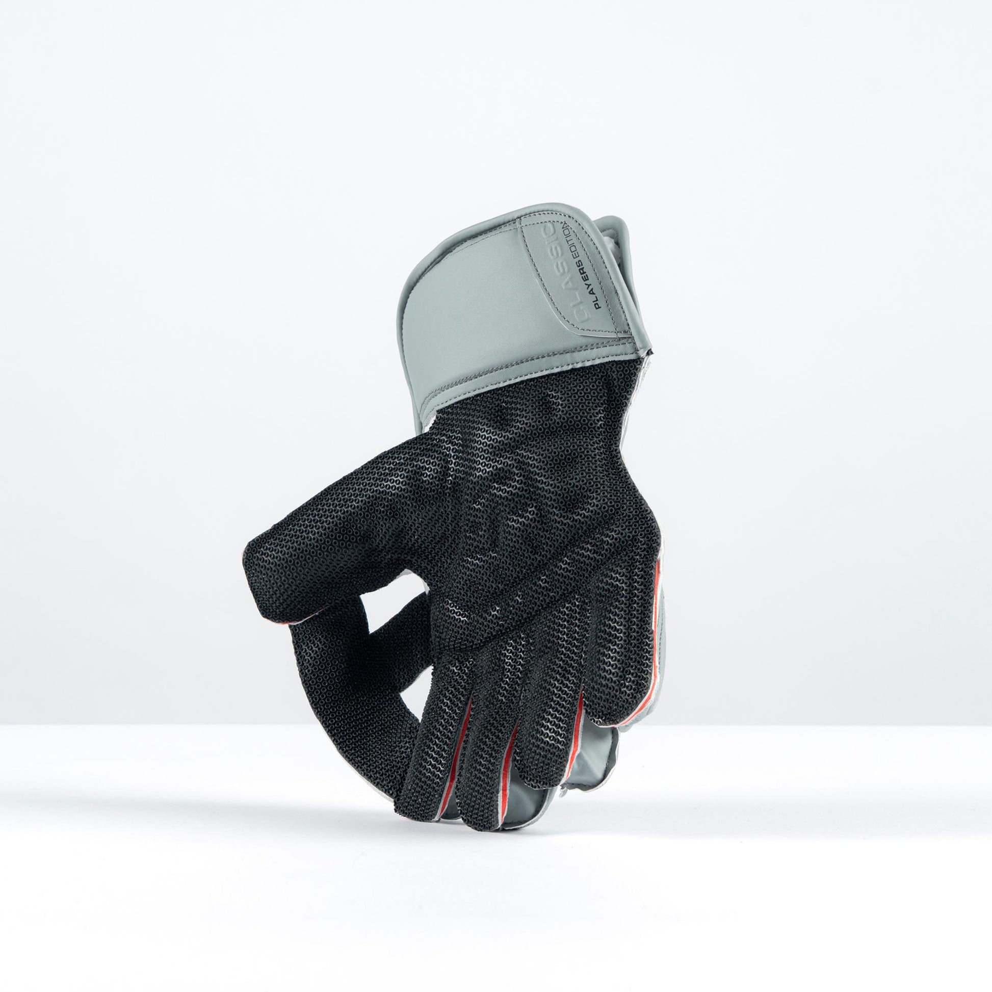 open palm view of Gray-Nicolls grey keeping gloves with octopus grip interior