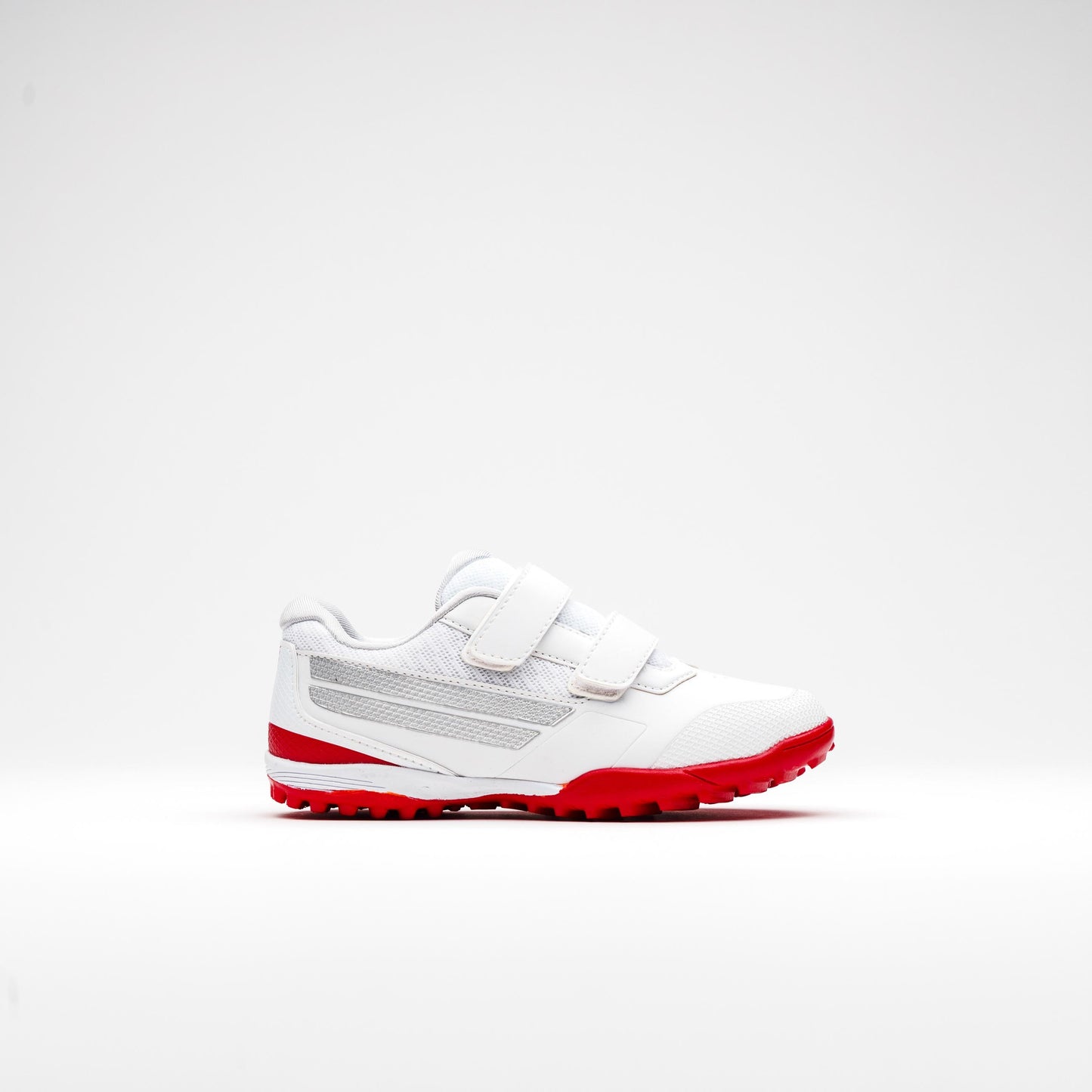 Right side profile of kids’ cricket shoes with red sole