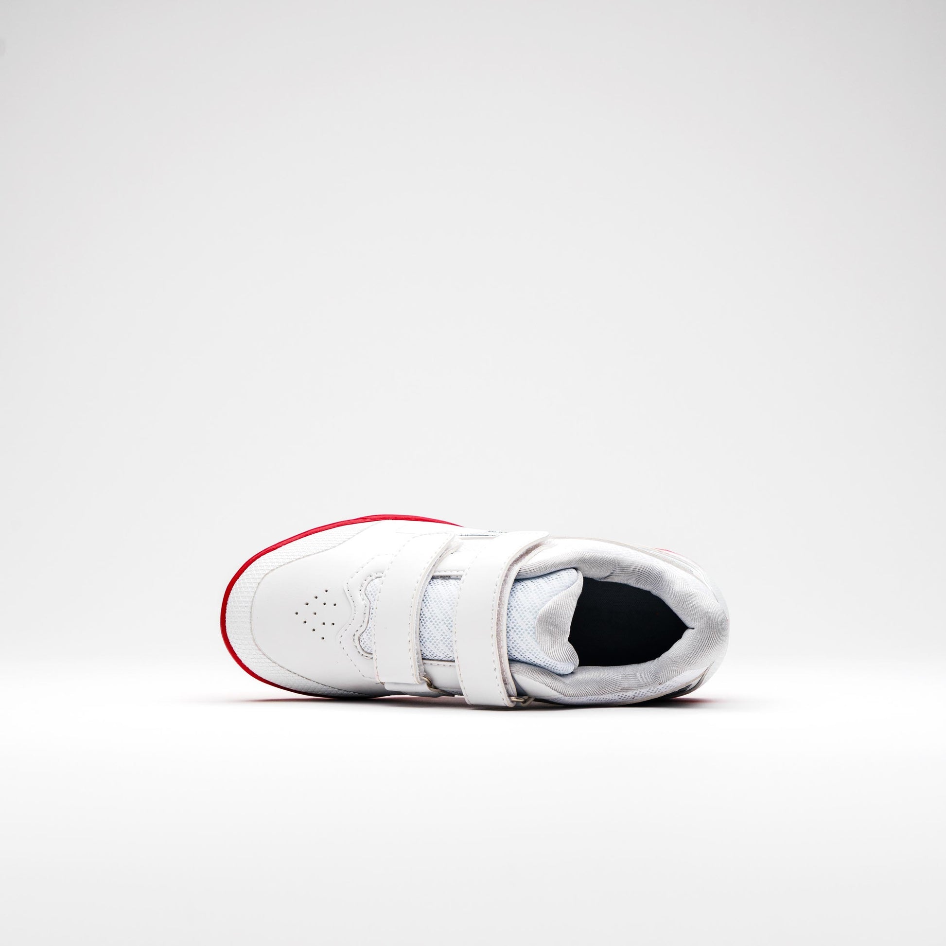 Top-down view of junior cricket shoes with velcro closure