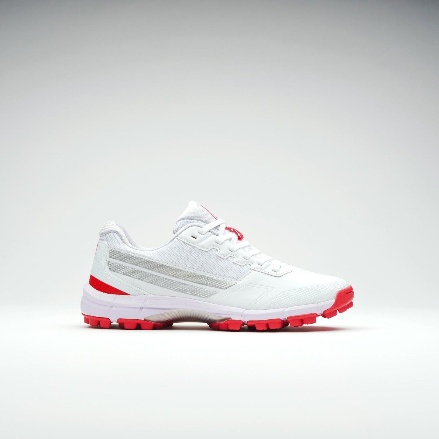 Opposite side view of white cricket shoes with durable outsole