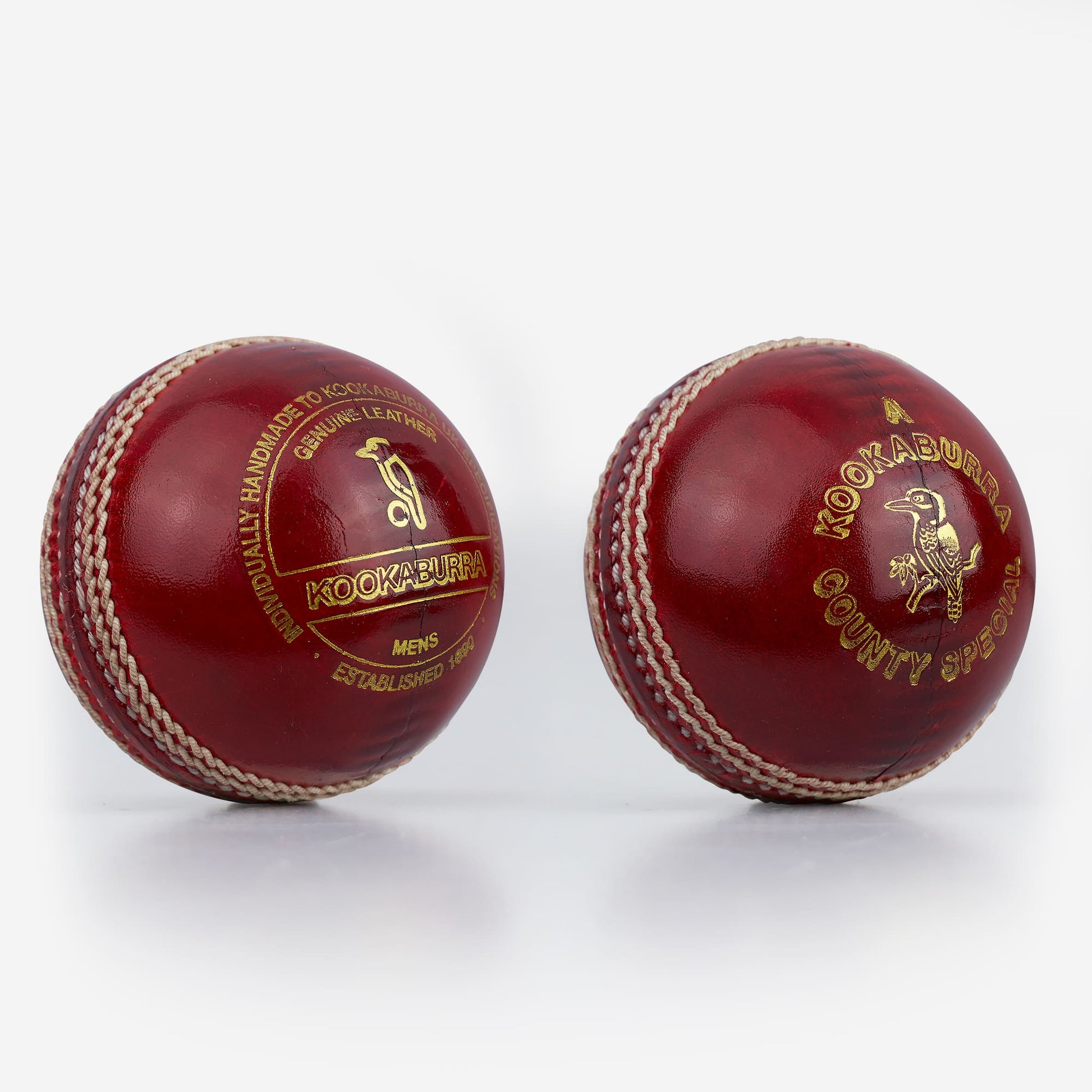 Kookaburra County Special red leather cricket balls showing front and back views with gold embossing