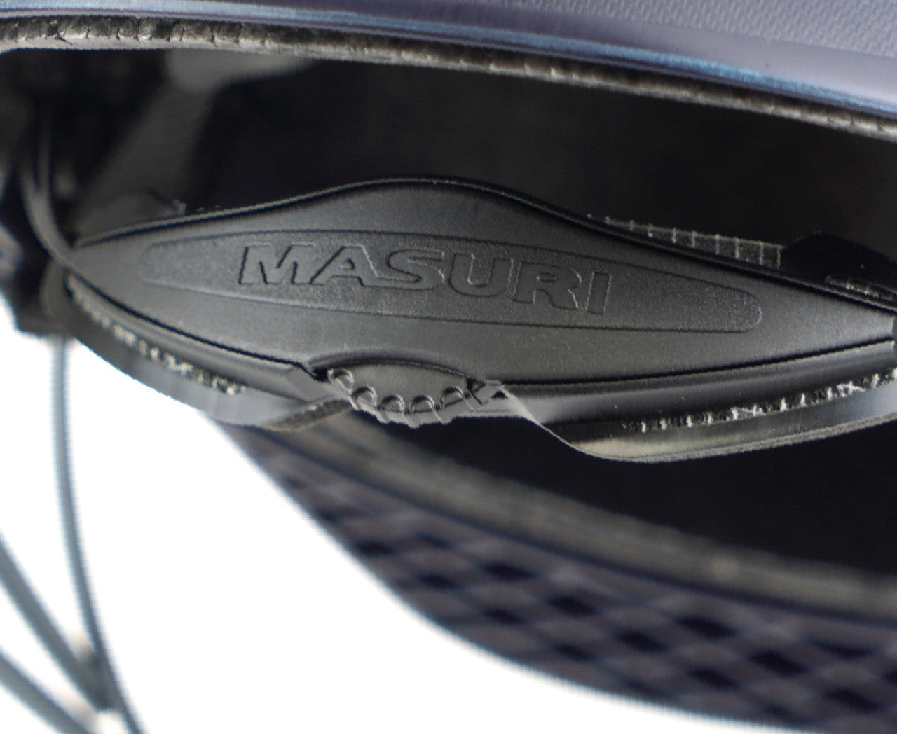 Close-up of dial adjuster at the rear of the Masuri C Line Junior Helmet for comfort and protection