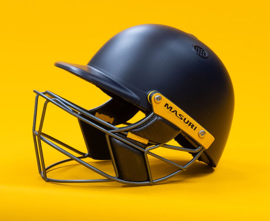 Masuri E-Line Plus Titanium senior cricket helmet in navy with titanium grille, left side profile view