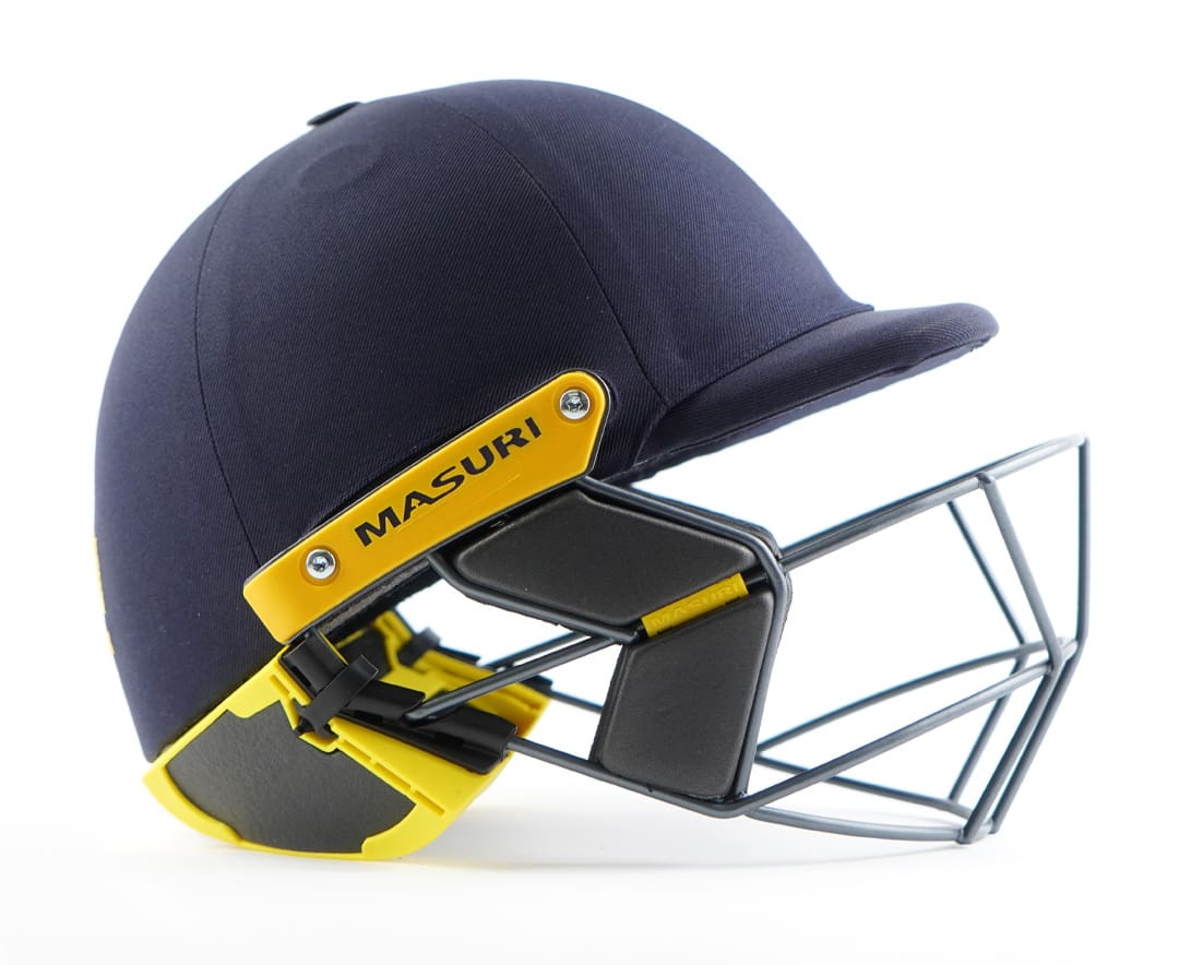Masuri StemGuard Lite Junior installed on a navy junior helmet, side profile showing secure fit
