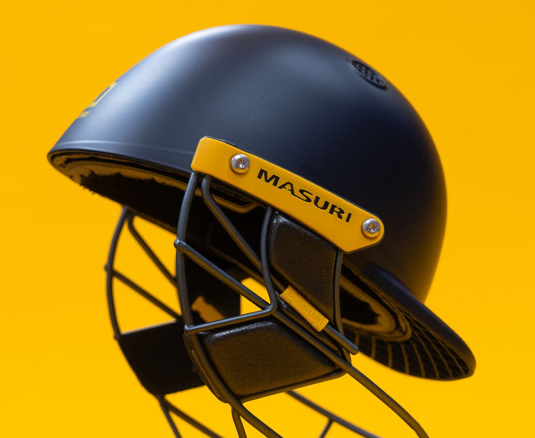 Close-up of Masuri T-Line Plus Steel senior helmet showing right side branding and steel face guard