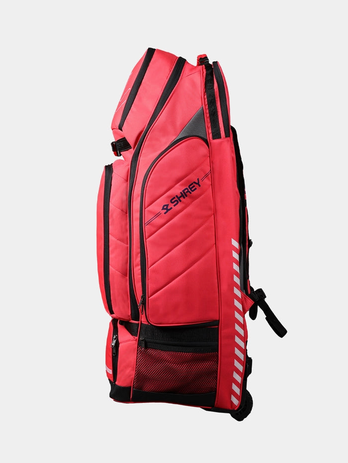 Side profile of the red Shrey Legacy Duffle Wheelie 120