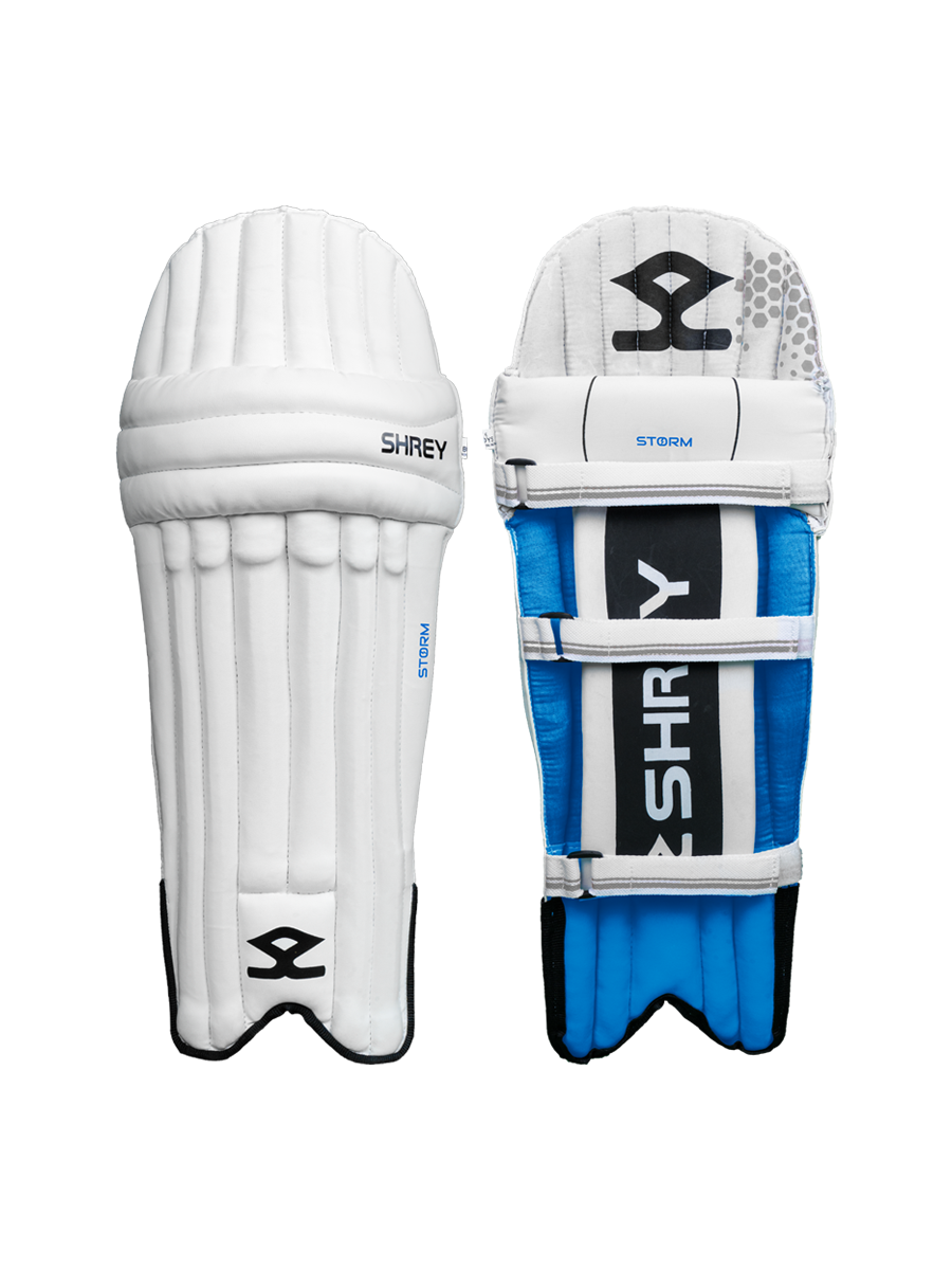 Pair of Shrey Storm white and blue junior cricket batting pads with front and strap view