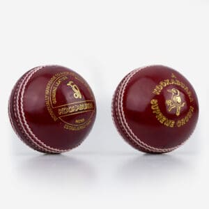 Two views of the Kookaburra Supreme Crown Cricket Ball in deep red, featuring gold embossed branding and hand-stitched white seam.