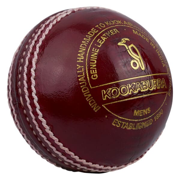 Close-up of the Kookaburra Supreme Crown Cricket Ball showing the Kookaburra logo, “Genuine Leather” marking, and fine stitching details.