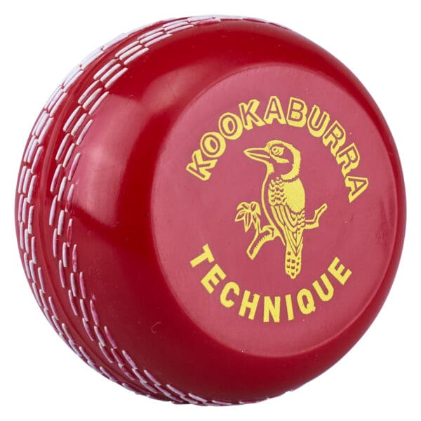 Front view of the Kookaburra Technique Trainer Cricket Ball showcasing gold branding and seam detail.Kookaburra Technique Trainer Cricket Ball front view with gold branding and seam detail