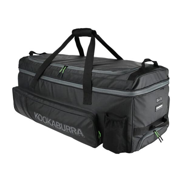 Side profile of the Kookaburra Pro Players cricket wheelie bag highlighting dual carry handles, external zip compartments, and drinks holder.