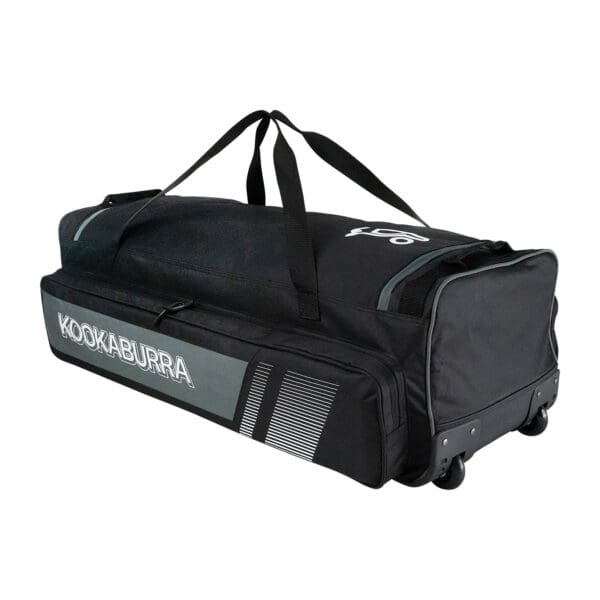Angled side view of the 2025 Kookaburra Pro 3500 Wheelie Bag in black and grey, showing durable carry handles, reinforced wheel base, and external branding.