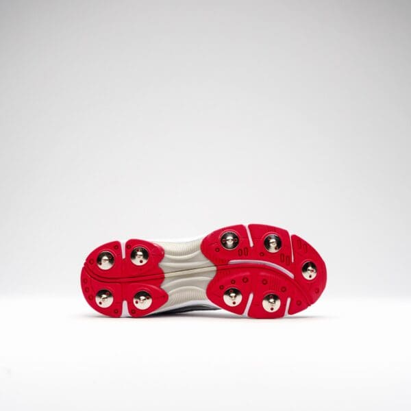 Full bottom view of Gray-Nicolls Velocity 5.0 Spike Shoe with red and white grip