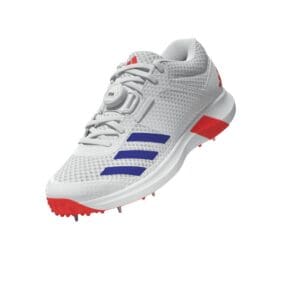 Angled front-side view of the Adidas Adipower Vector Mid Cricket Spike in white with red sole and blue stripes, featuring a BOA fit system and mid-cut ankle support.