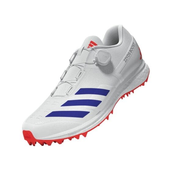Angled front-side view of the Adidas 22Yards Boost showing the full closure system, breathable upper, and red-grip outsole.