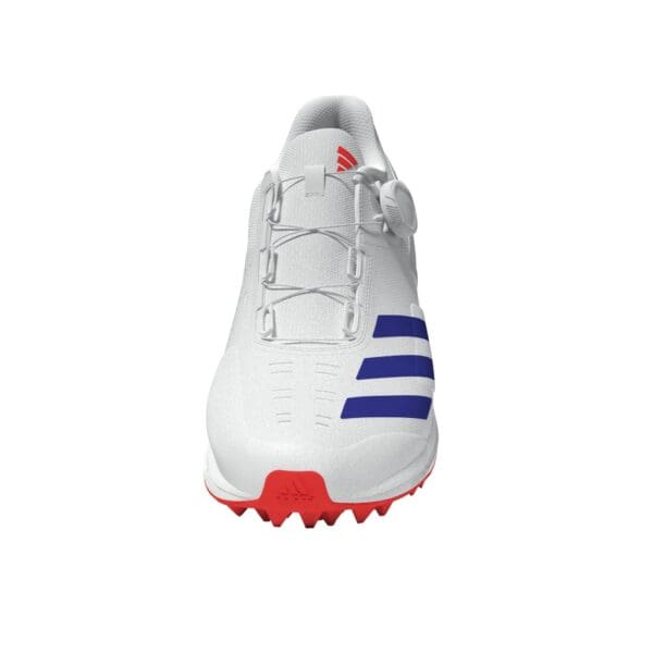 Front view of the Adidas 22Yards Boost with centralised BOA dial, red sole grip, and blue Adidas stripes across the instep.