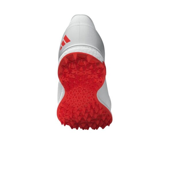Bottom view of the Adidas 22Yards Boost Cricket Shoe featuring a bright red rubber outsole with textured grip for multi-surface traction.