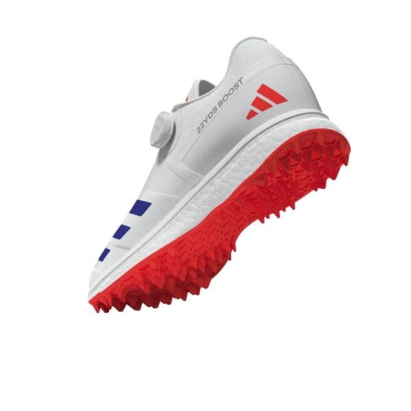 Rear-side angled view of the Adidas 22Yards Boost, showing the BOOST midsole, red grippy outsole, and "22YDS BOOST" branding near the heel.