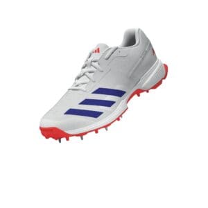 Angled front-side view of the Adidas 22Yards Cricket Spike, showing its lace-up closure, red sole, and aerodynamic design.